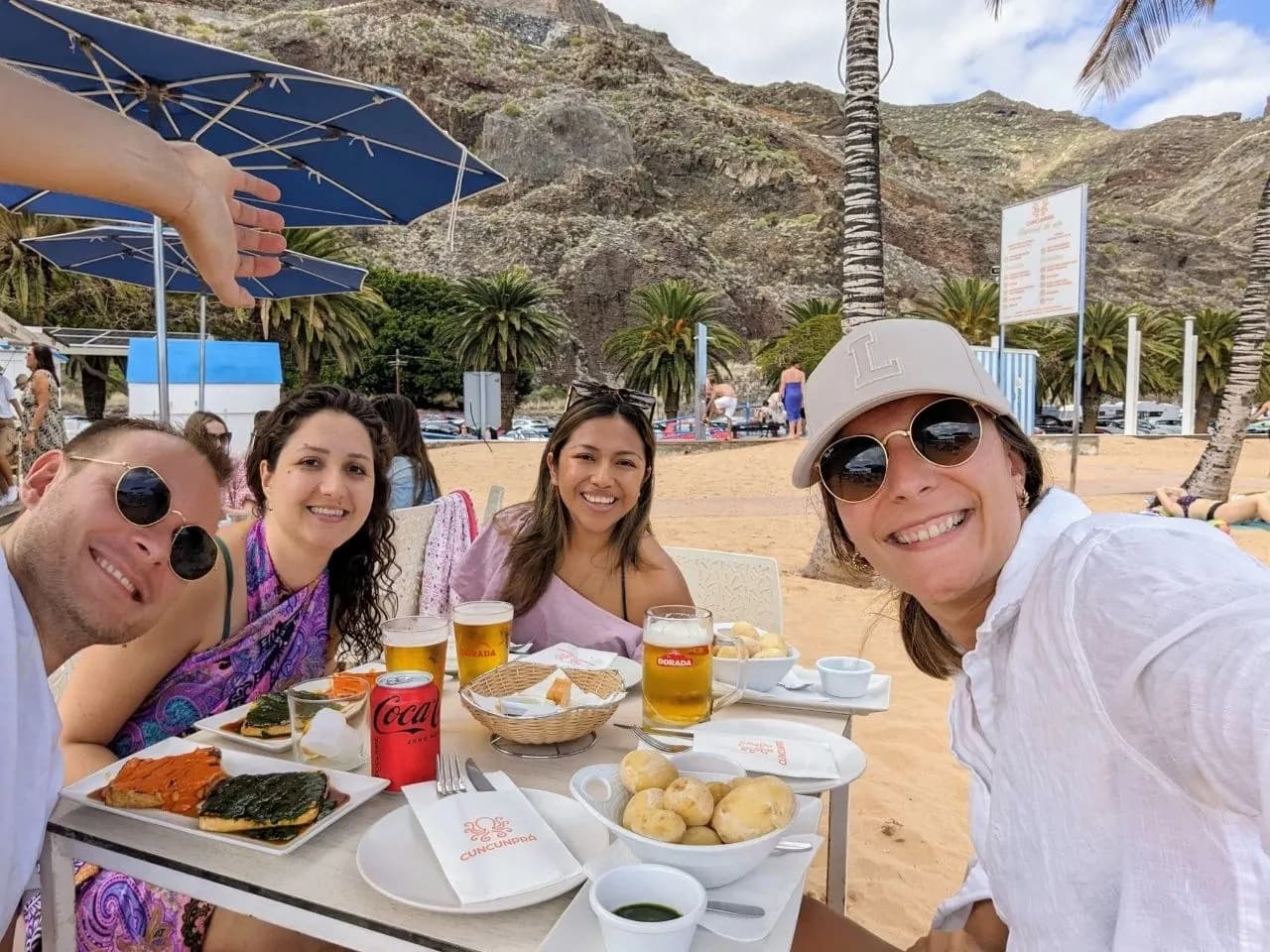 Blue Paradise community enjoying a beach meal near Santa Cruz de Tenerife.